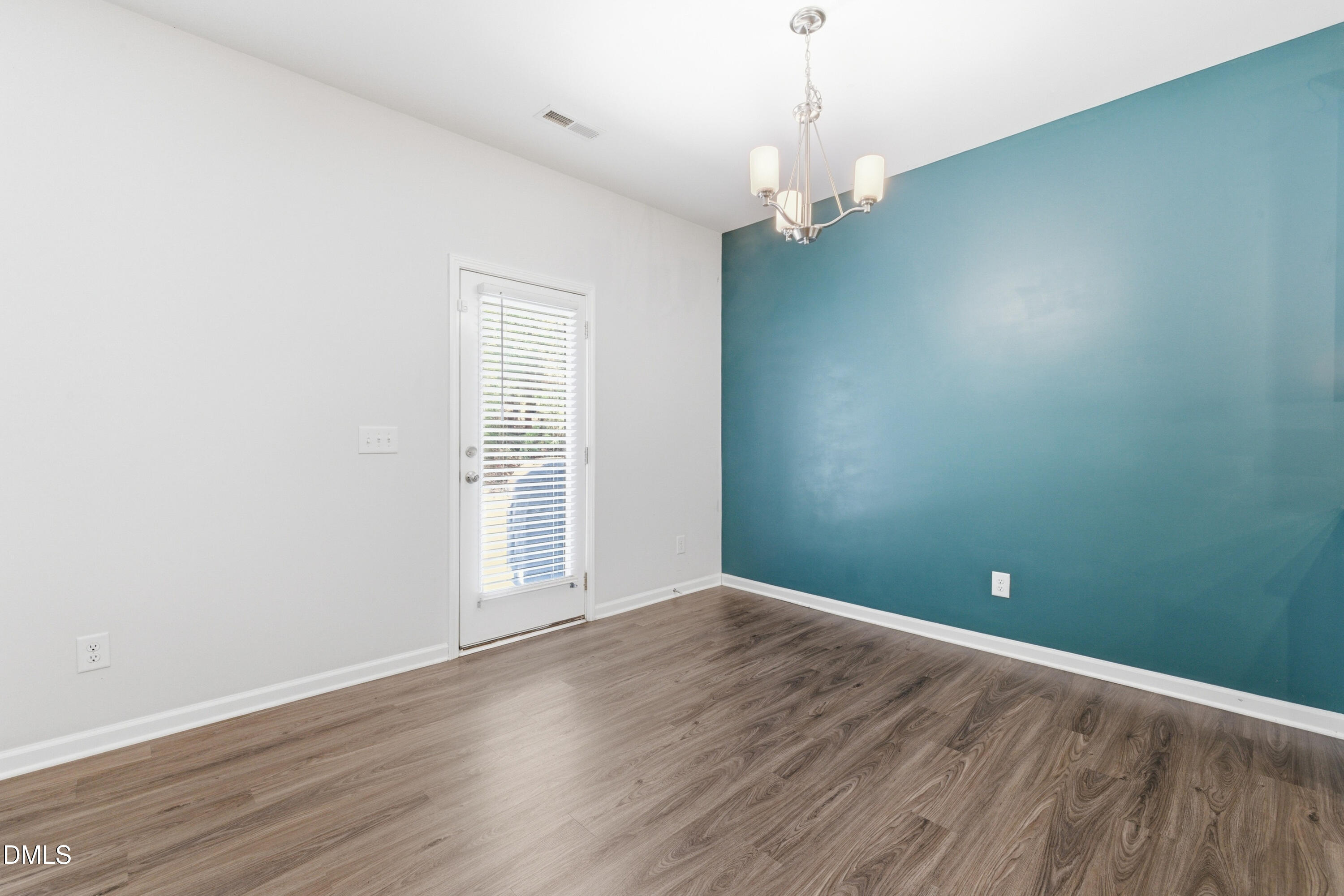 1044 Flagler Street Durham, NC 27713 - Photo 13 of 33 a view of empty room with wooden floor