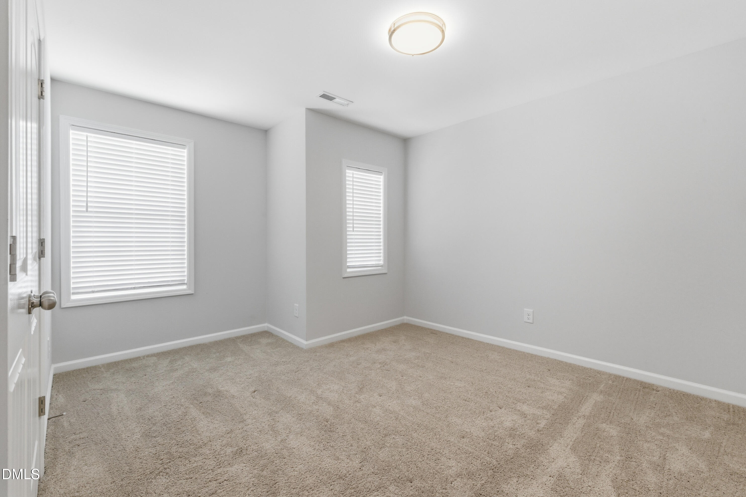 1044 Flagler Street Durham, NC 27713 - Photo 19 of 33 an empty room with windows