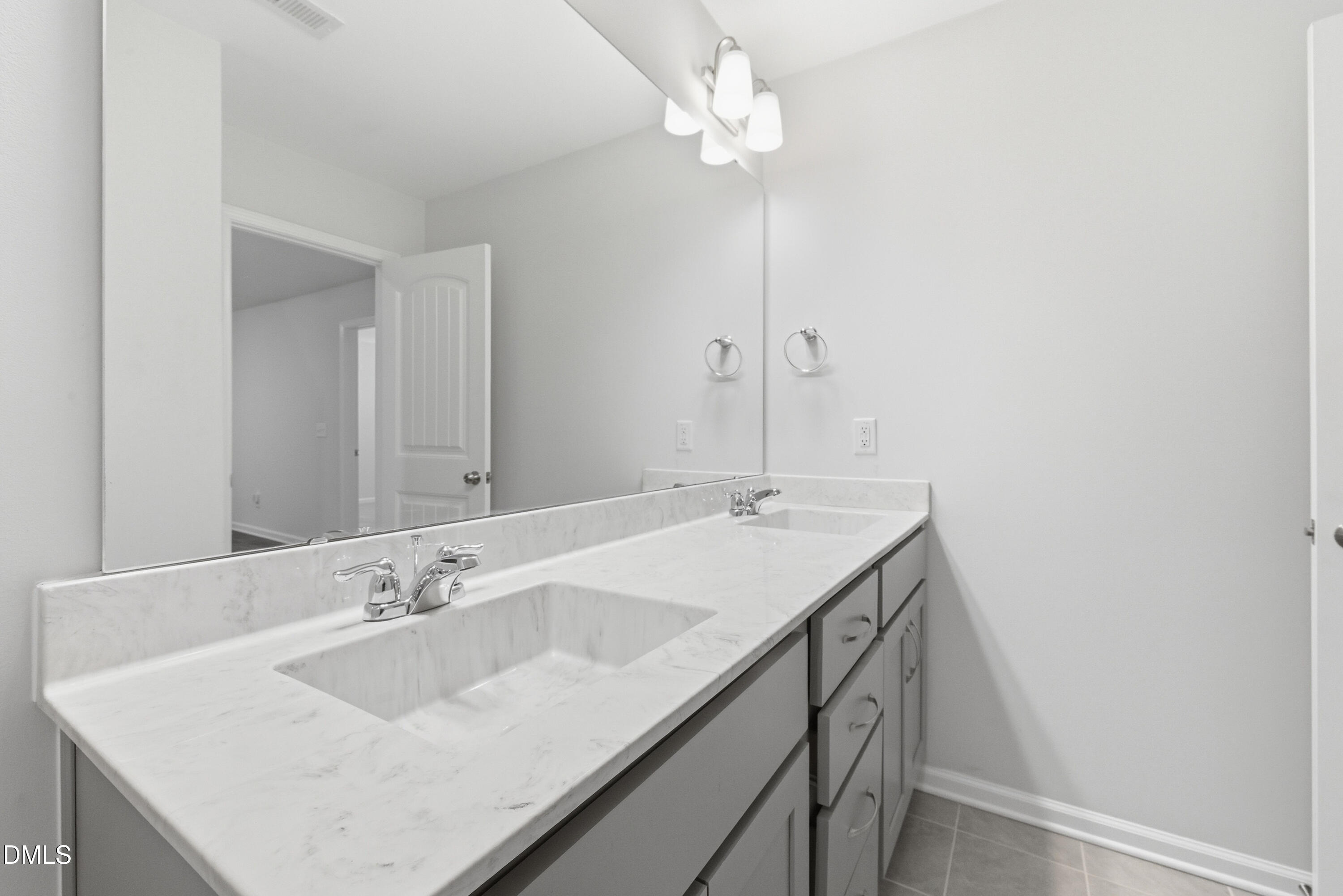 1044 Flagler Street Durham, NC 27713 - Photo 22 of 33 a bathroom with a sink and a mirror