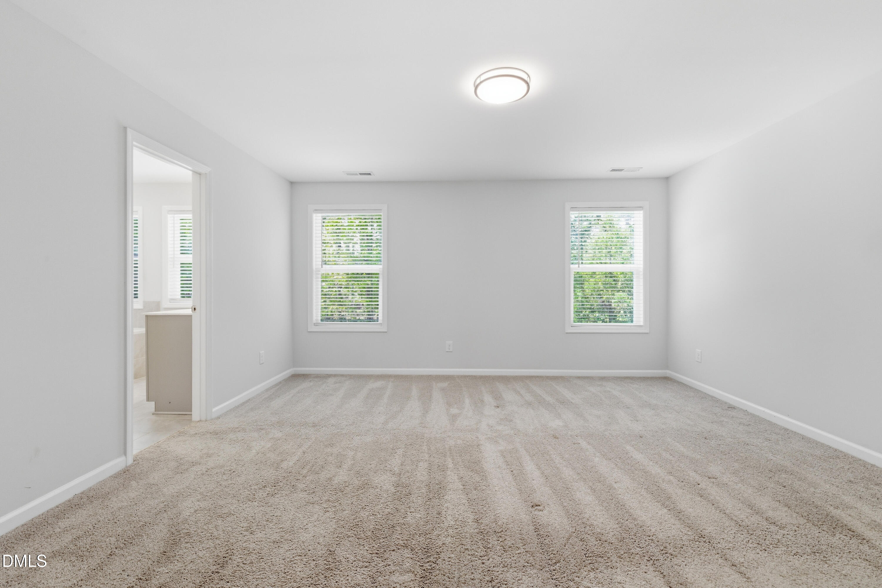 1044 Flagler Street Durham, NC 27713 - Photo 24 of 33 an empty room with windows