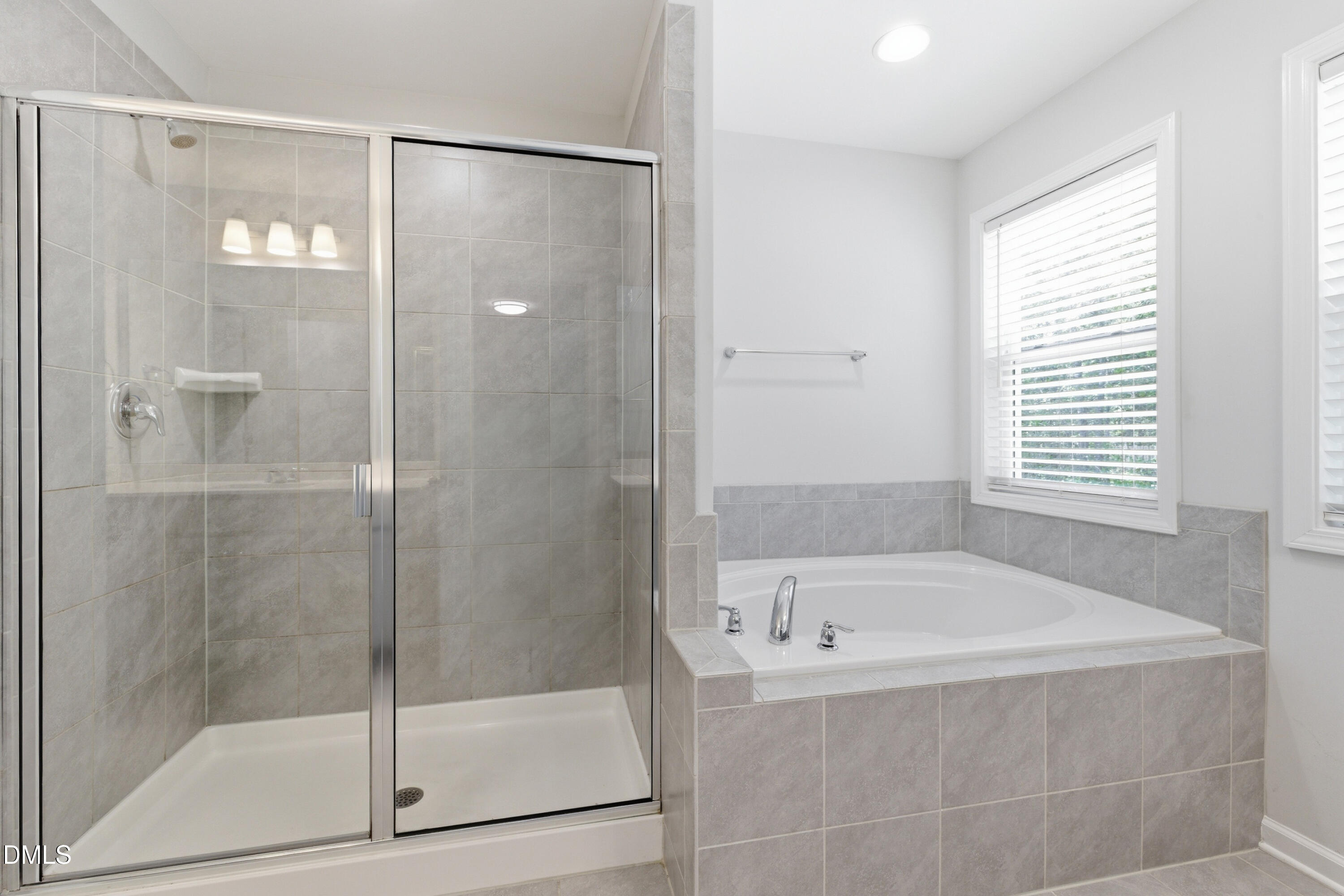 1044 Flagler Street Durham, NC 27713 - Photo 27 of 33 a white bath tub sitting next to a shower