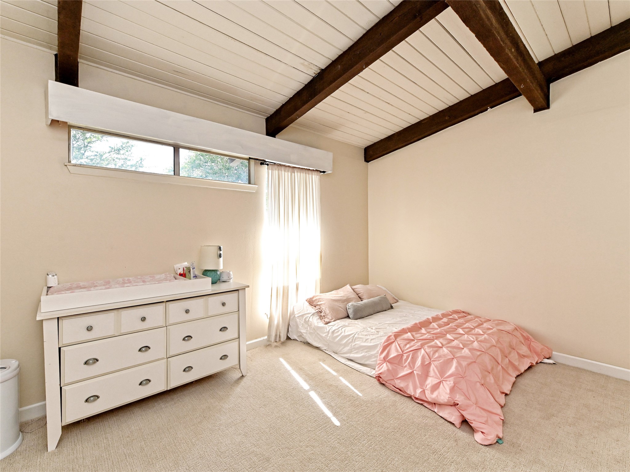 115 Snapper Street Lakeway, TX 78734 - Photo 20 of 30 Exposed wood beams add architectural interest to this bright, inviting bedroom.
