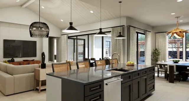 a kitchen with stainless steel appliances granite countertop a sink a stove and a wooden floors