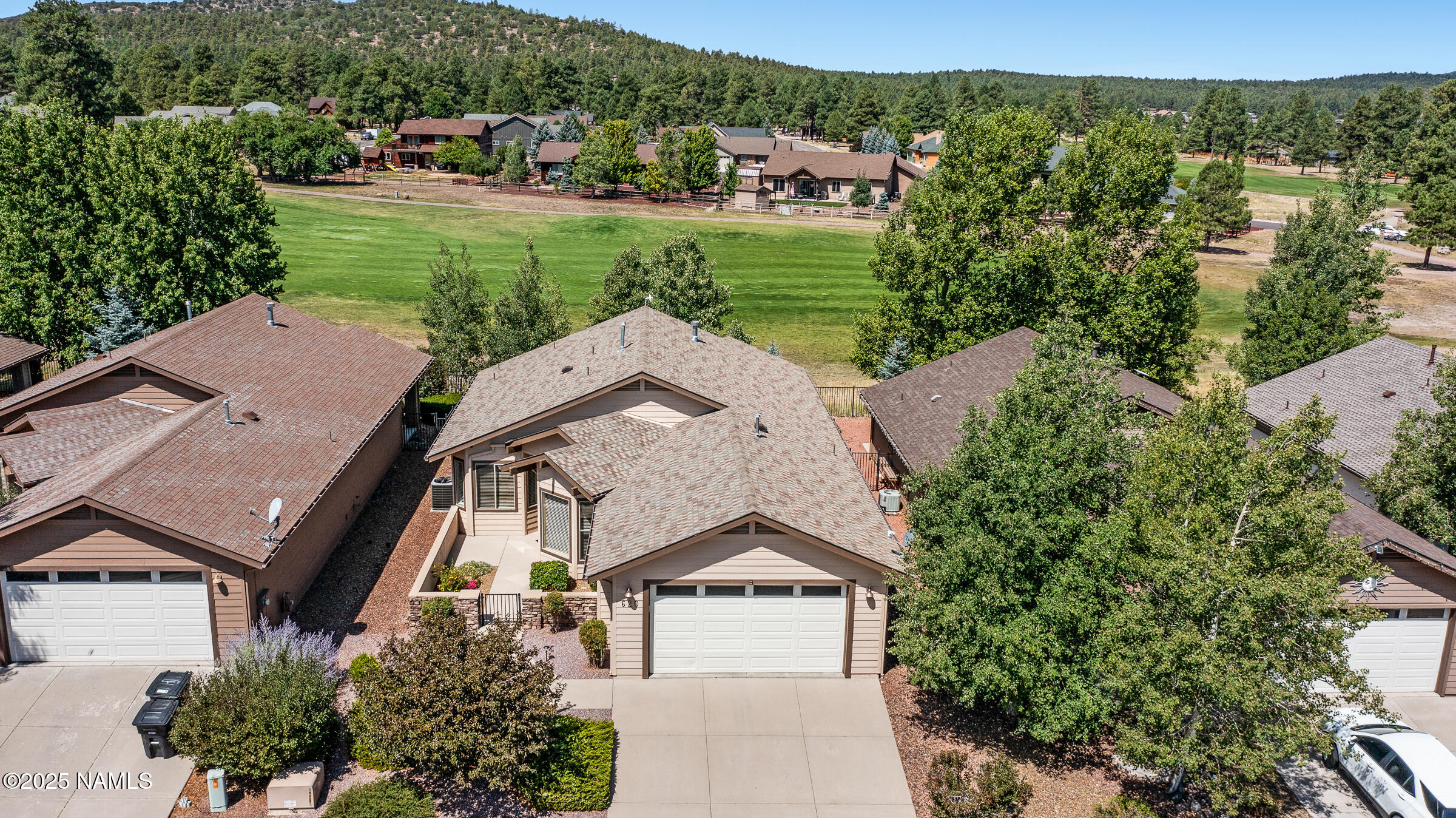 an aerial view of a house with a garden