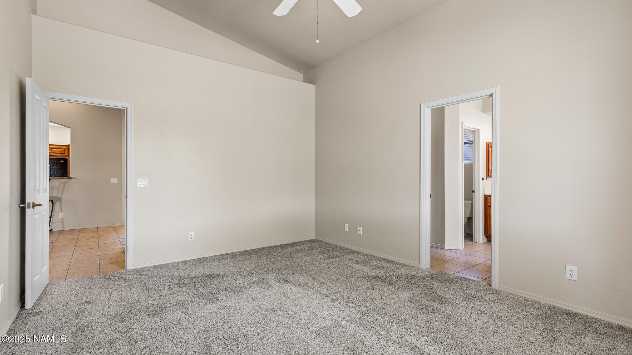 620 Brookline Loop Williams, AZ 86046 - Photo 11 of 38 an empty room with closet and a bathroom