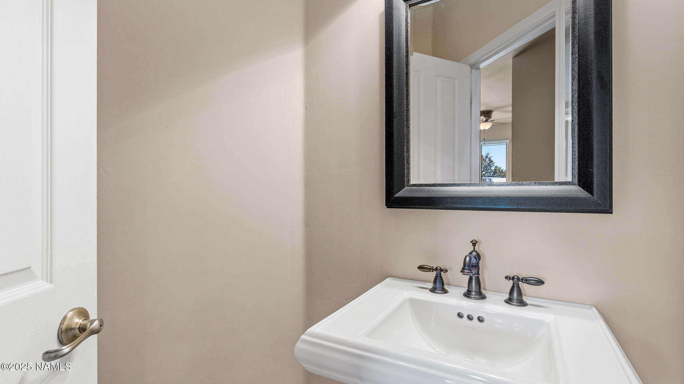 620 Brookline Loop Williams, AZ 86046 - Photo 18 of 38 a bathroom with a sink and a mirror