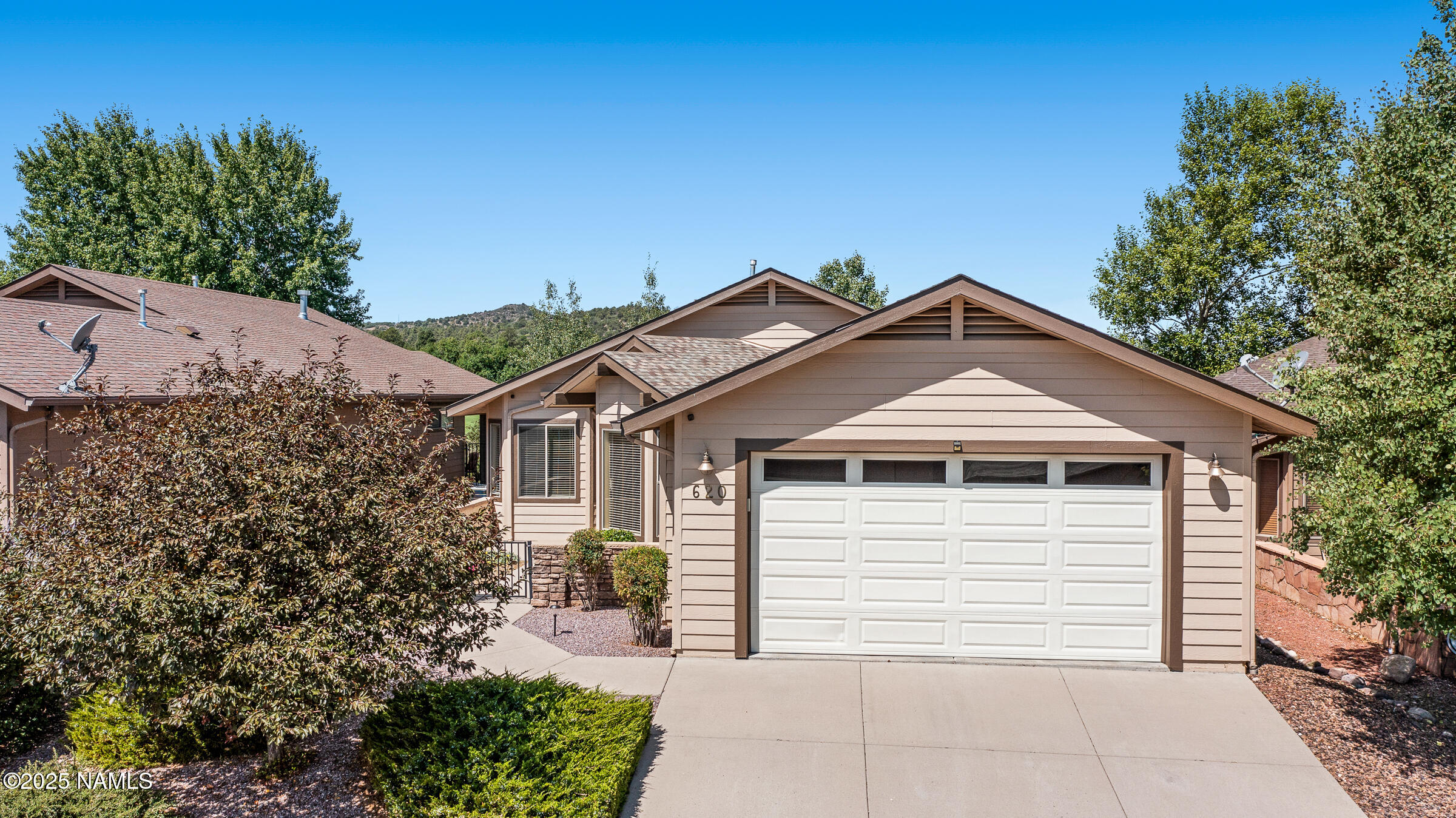 620 Brookline Loop Williams, AZ 86046 - Photo 23 of 38 a front view of a house with a garden