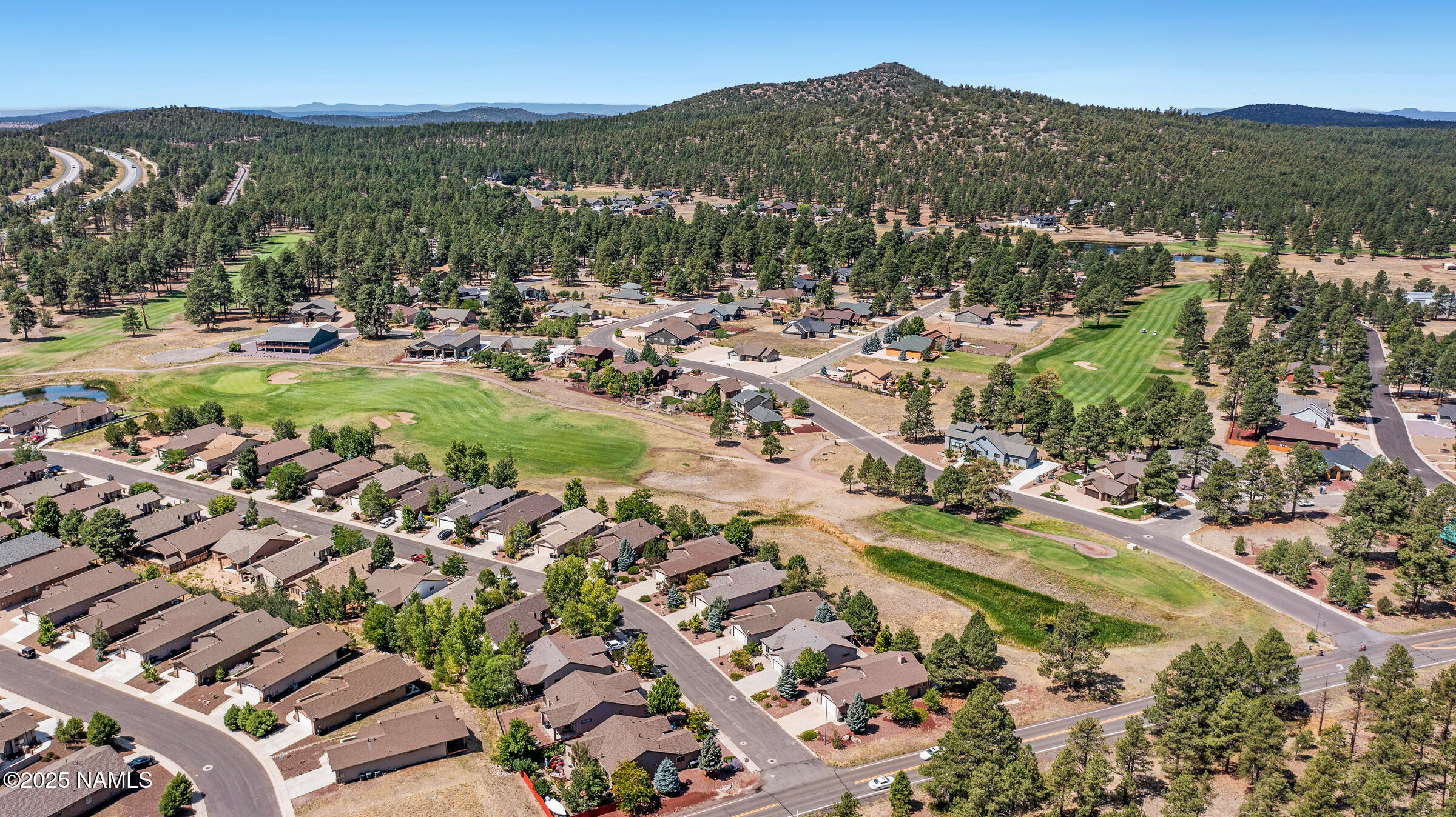 620 Brookline Loop Williams, AZ 86046 - Photo 26 of 38 an aerial view of residential houses with outdoor space and trees