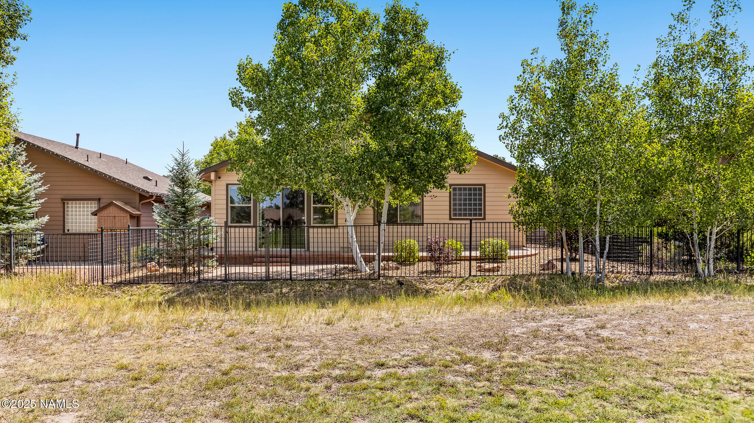 620 Brookline Loop Williams, AZ 86046 - Photo 36 of 38 a view of a house with swimming pool and sitting area