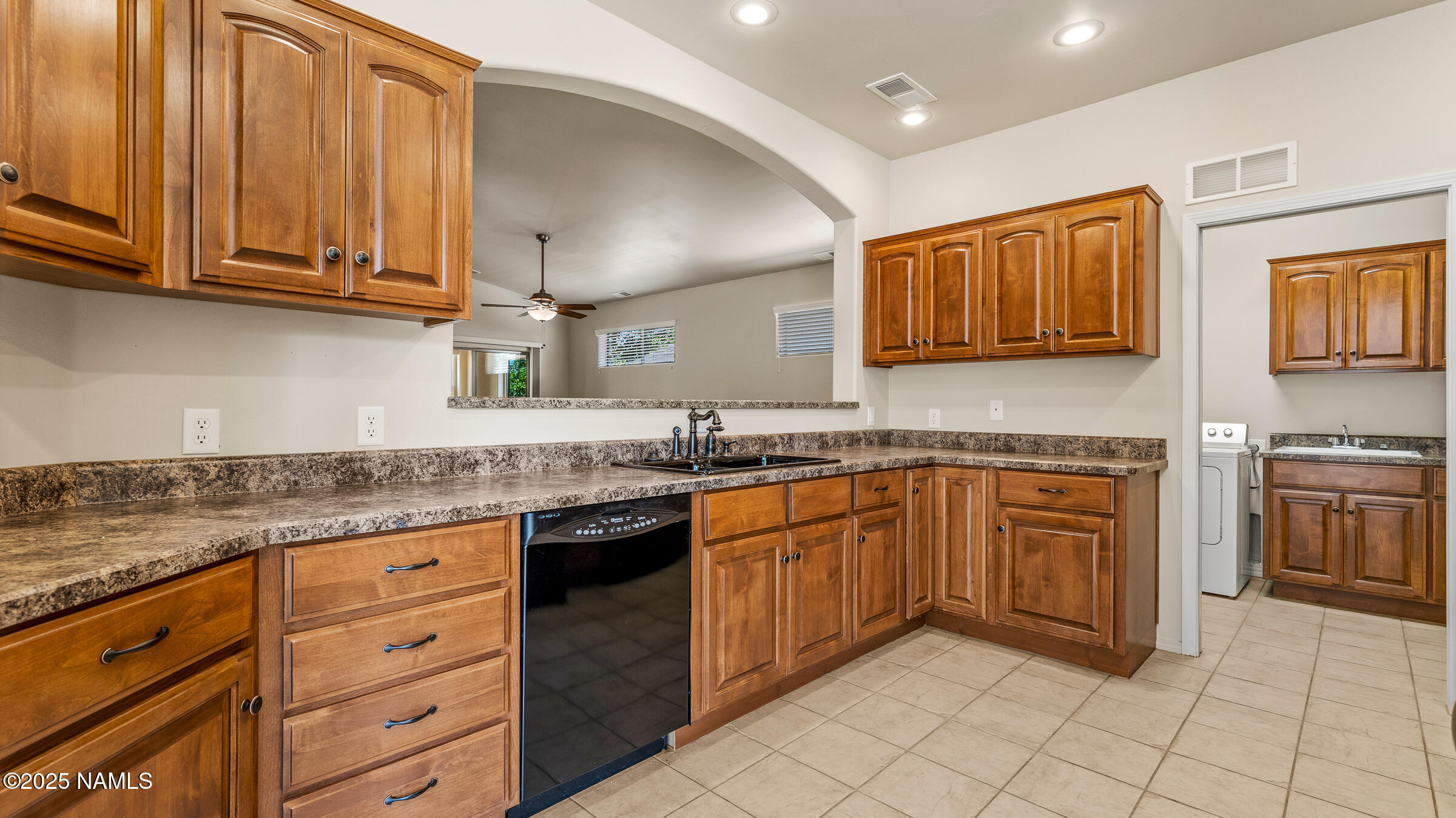 620 Brookline Loop Williams, AZ 86046 - Photo 7 of 38 a kitchen with stainless steel appliances granite countertop a sink stove and cabinets
