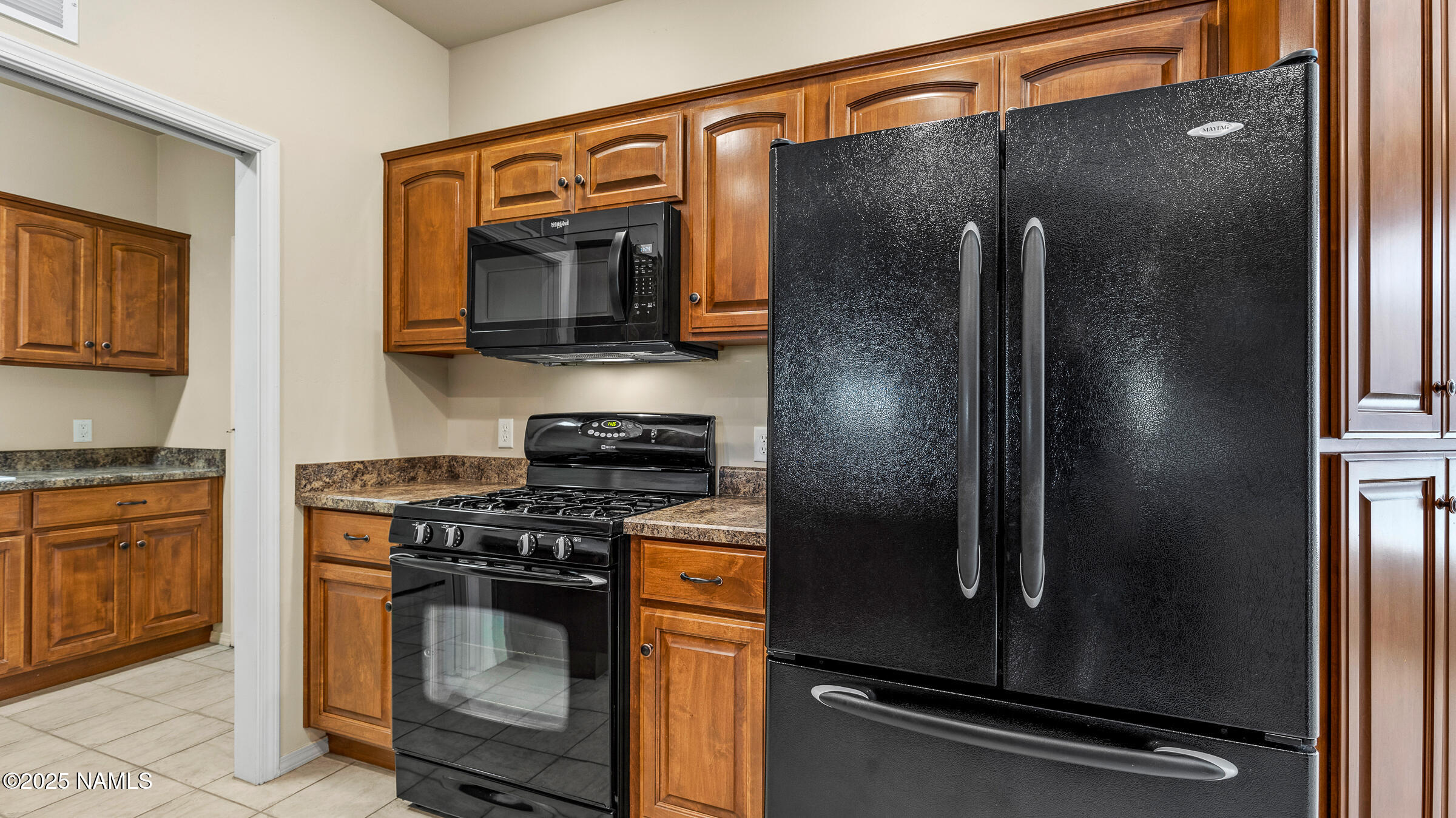 620 Brookline Loop Williams, AZ 86046 - Photo 8 of 38 a kitchen with stainless steel appliances granite countertop a refrigerator and a stove top oven