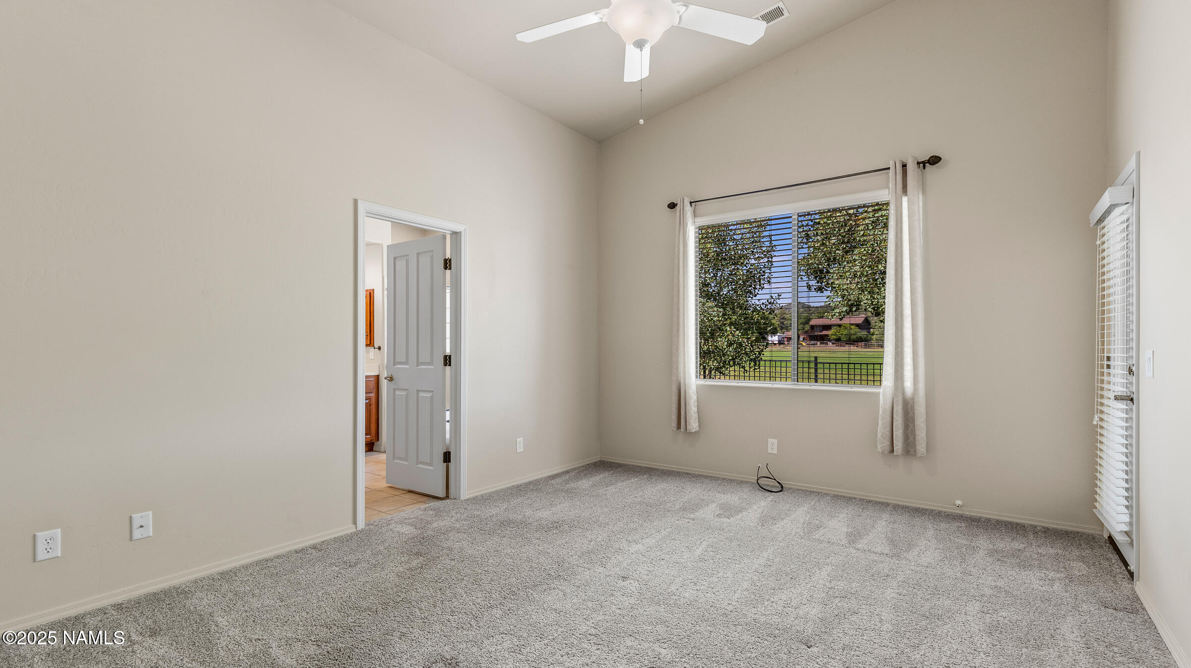 620 Brookline Loop Williams, AZ 86046 - Photo 10 of 38 an empty room with windows and closet