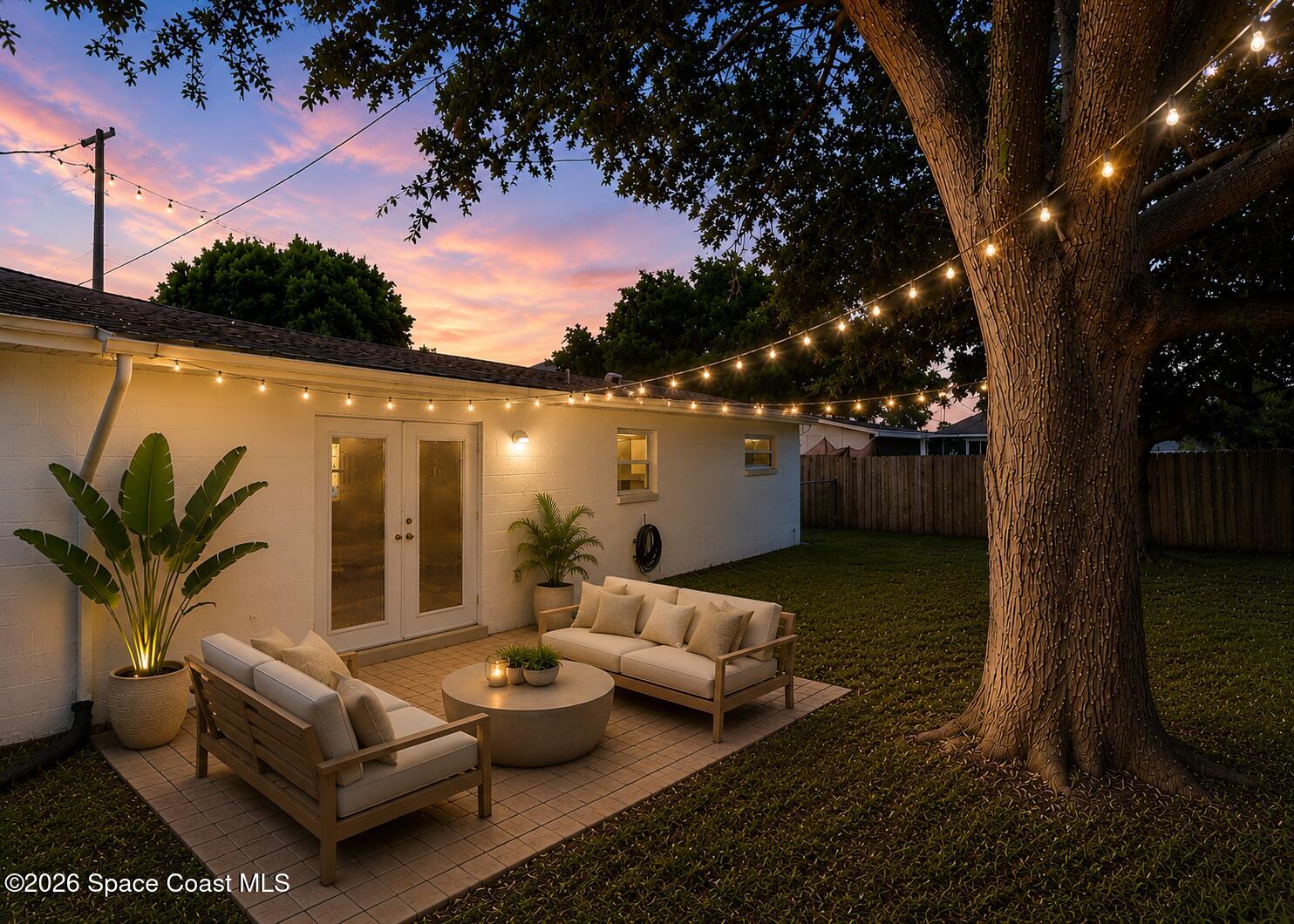 987 Kings Post Road Rockledge, FL 32955 - Photo 10 of 30 a view of a patio with couches and a large tree