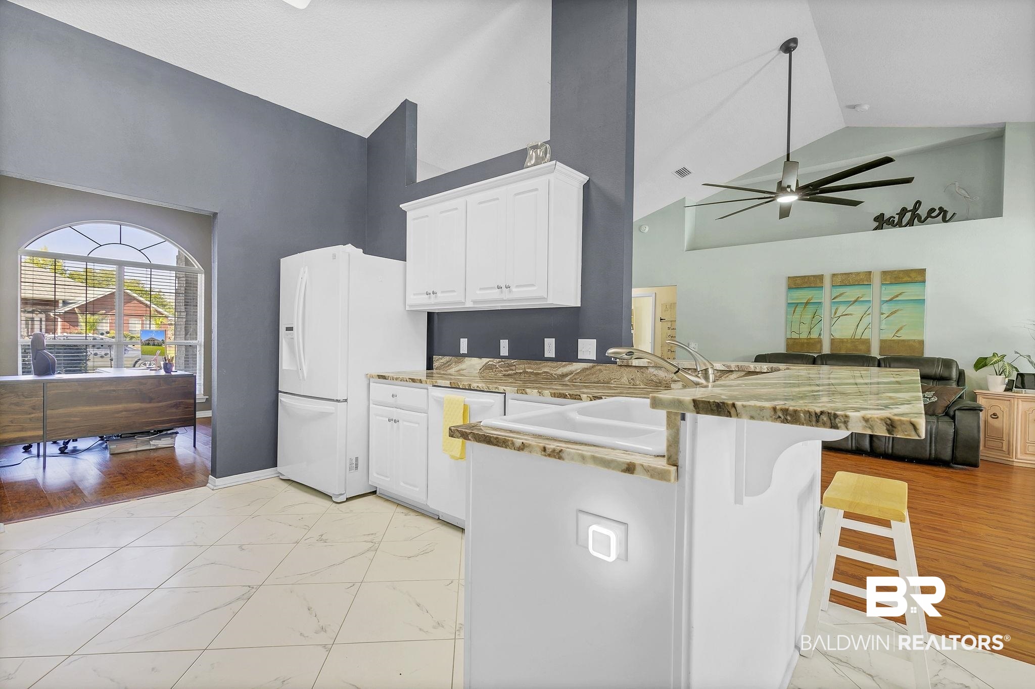 16358 Tempest Drive Foley, AL 36535 - Photo 14 of 46 Kitchen with white cabinets, marble finish floor, white appliances, ceiling fan, and high vaulted ceiling
