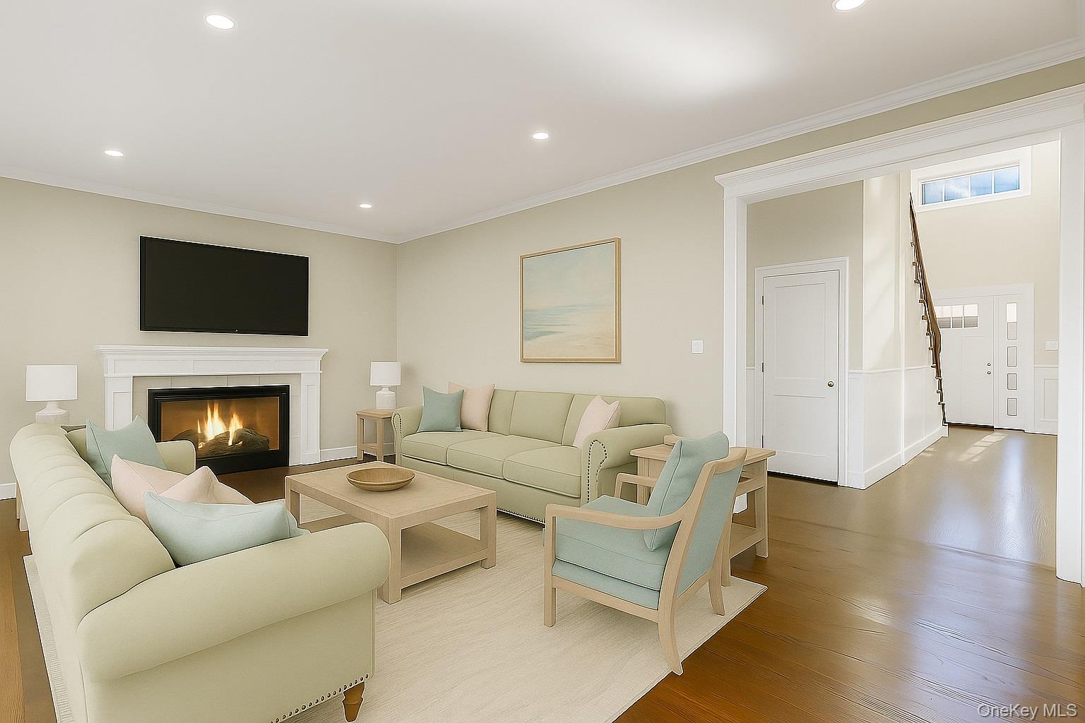9 Hickory Road Bayville, NY 11709 - Photo 16 of 40 a living room with furniture a flat screen tv and a fireplace