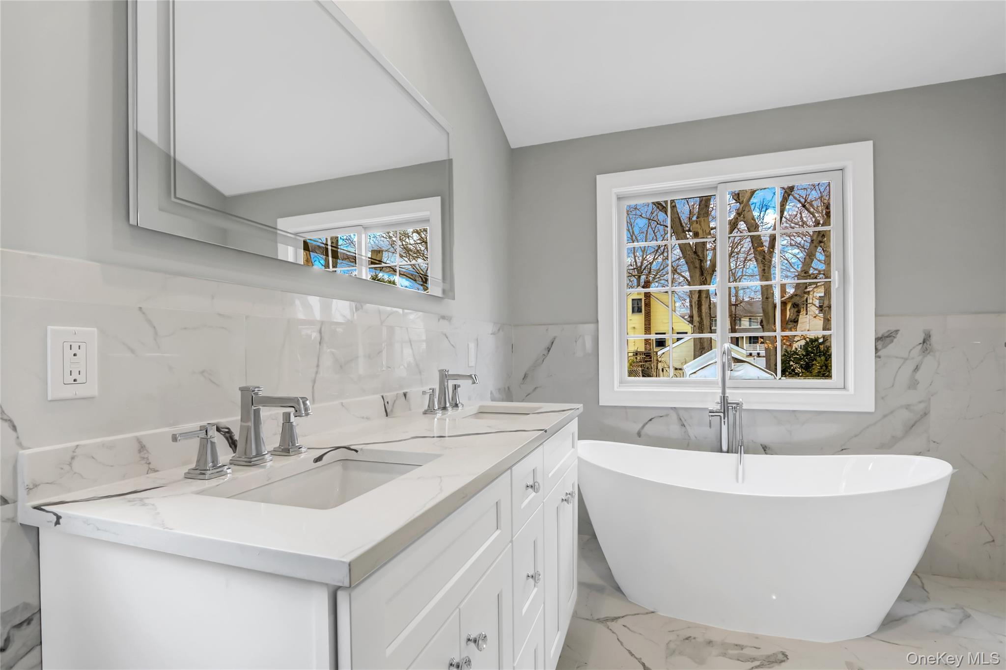 9 Hickory Road Bayville, NY 11709 - Photo 23 of 40 a bathroom with a sink and a bathtub
