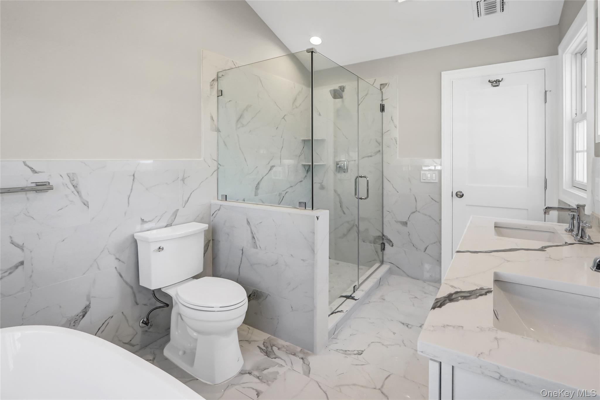 9 Hickory Road Bayville, NY 11709 - Photo 24 of 40 a bathroom with a sink toilet and shower