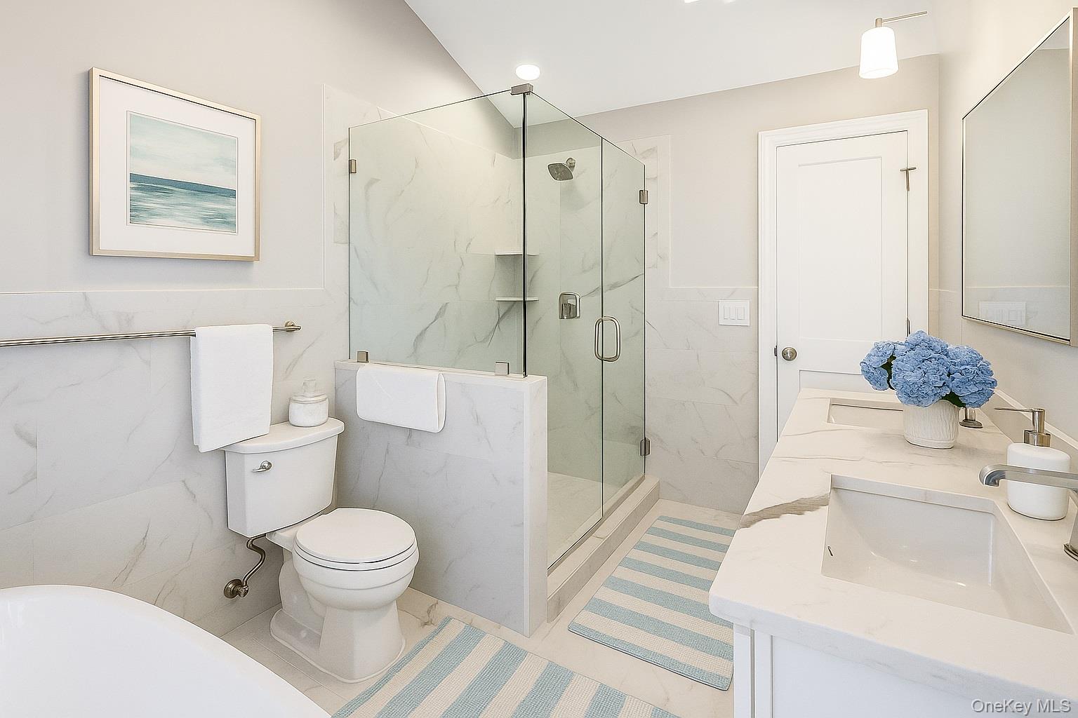 9 Hickory Road Bayville, NY 11709 - Photo 25 of 40 a bathroom with a sink a toilet and shower