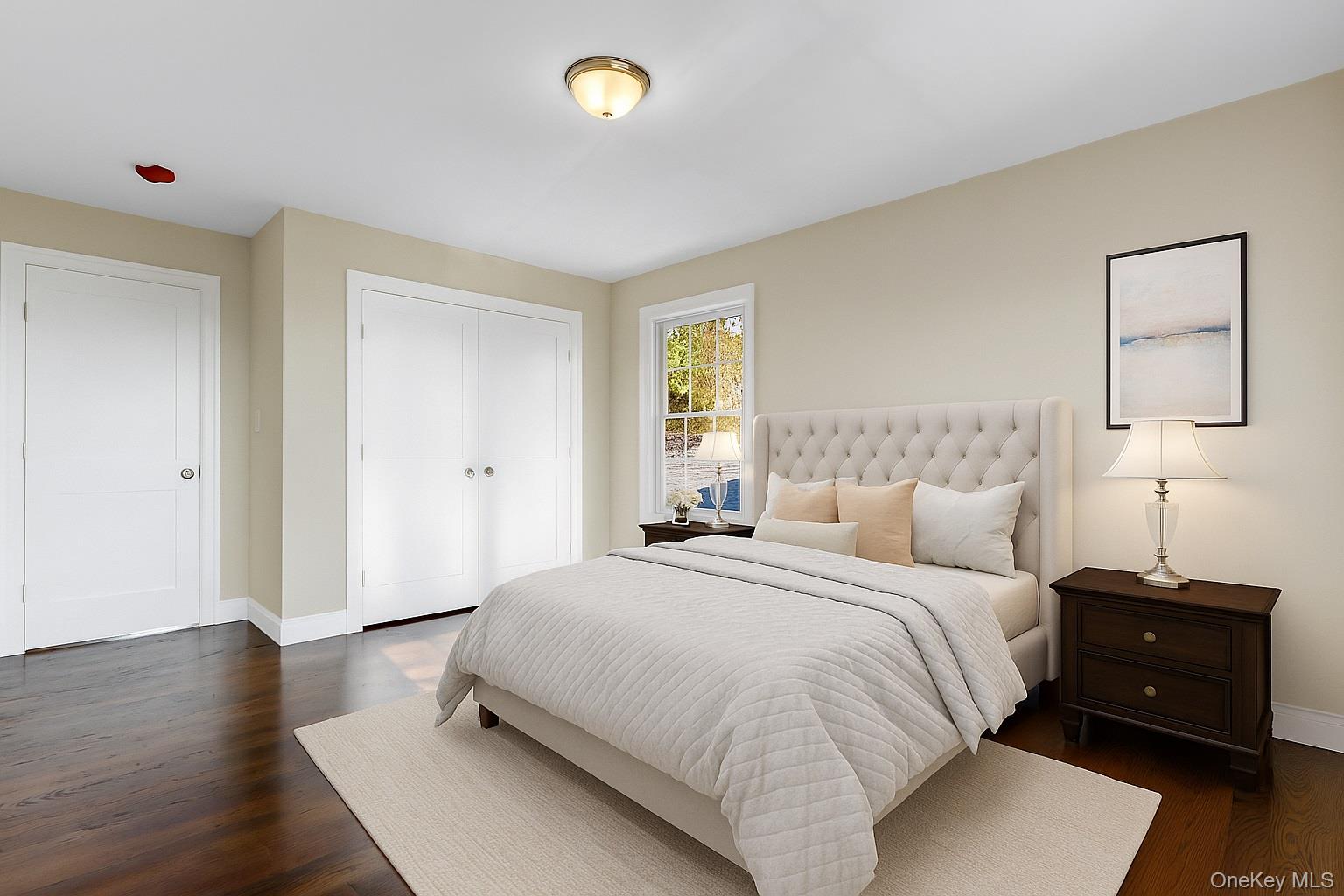 9 Hickory Road Bayville, NY 11709 - Photo 34 of 40 a bedroom with a bed and wooden floor