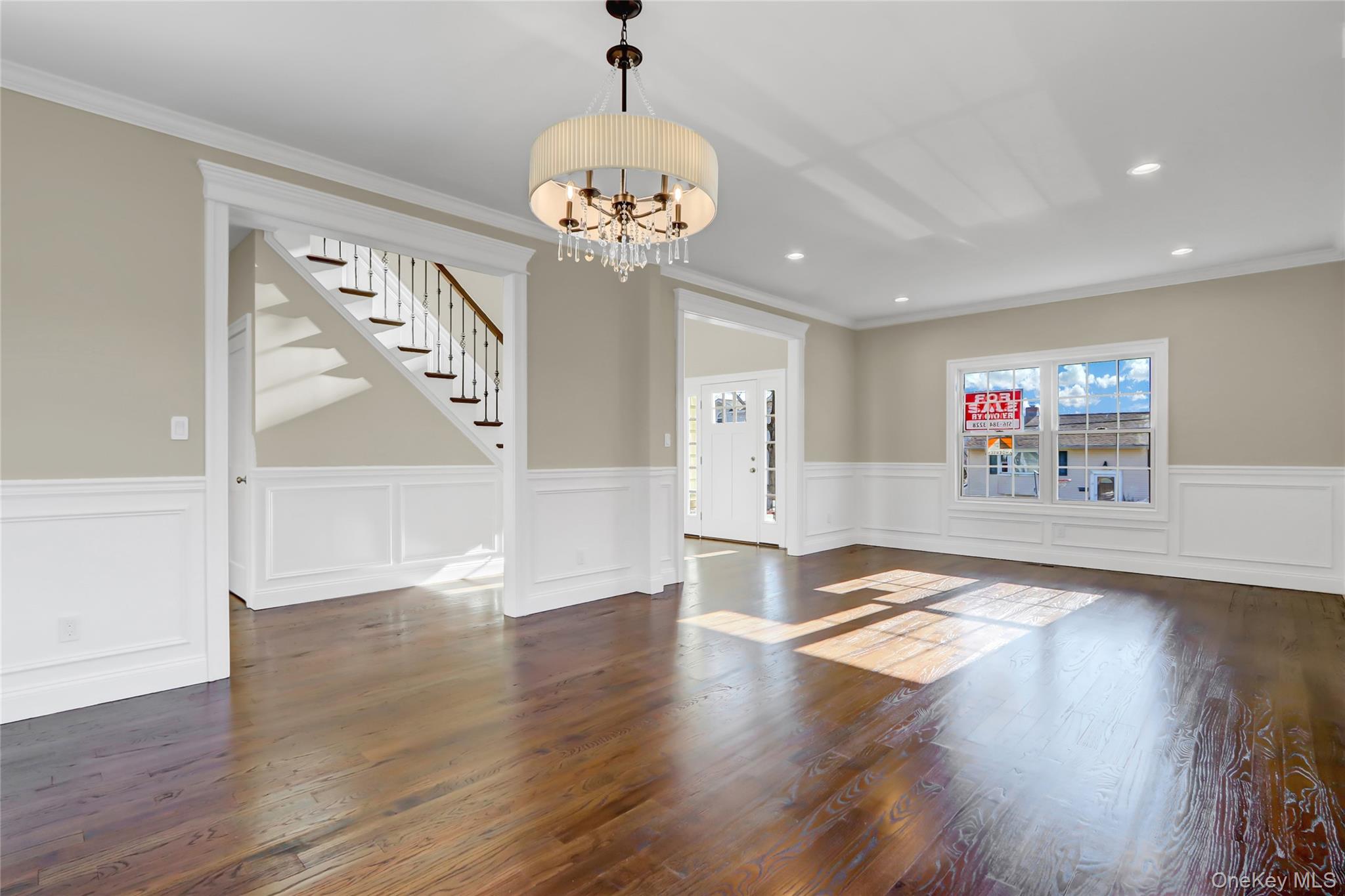 9 Hickory Road Bayville, NY 11709 - Photo 8 of 40 a view of an empty room with wooden floor