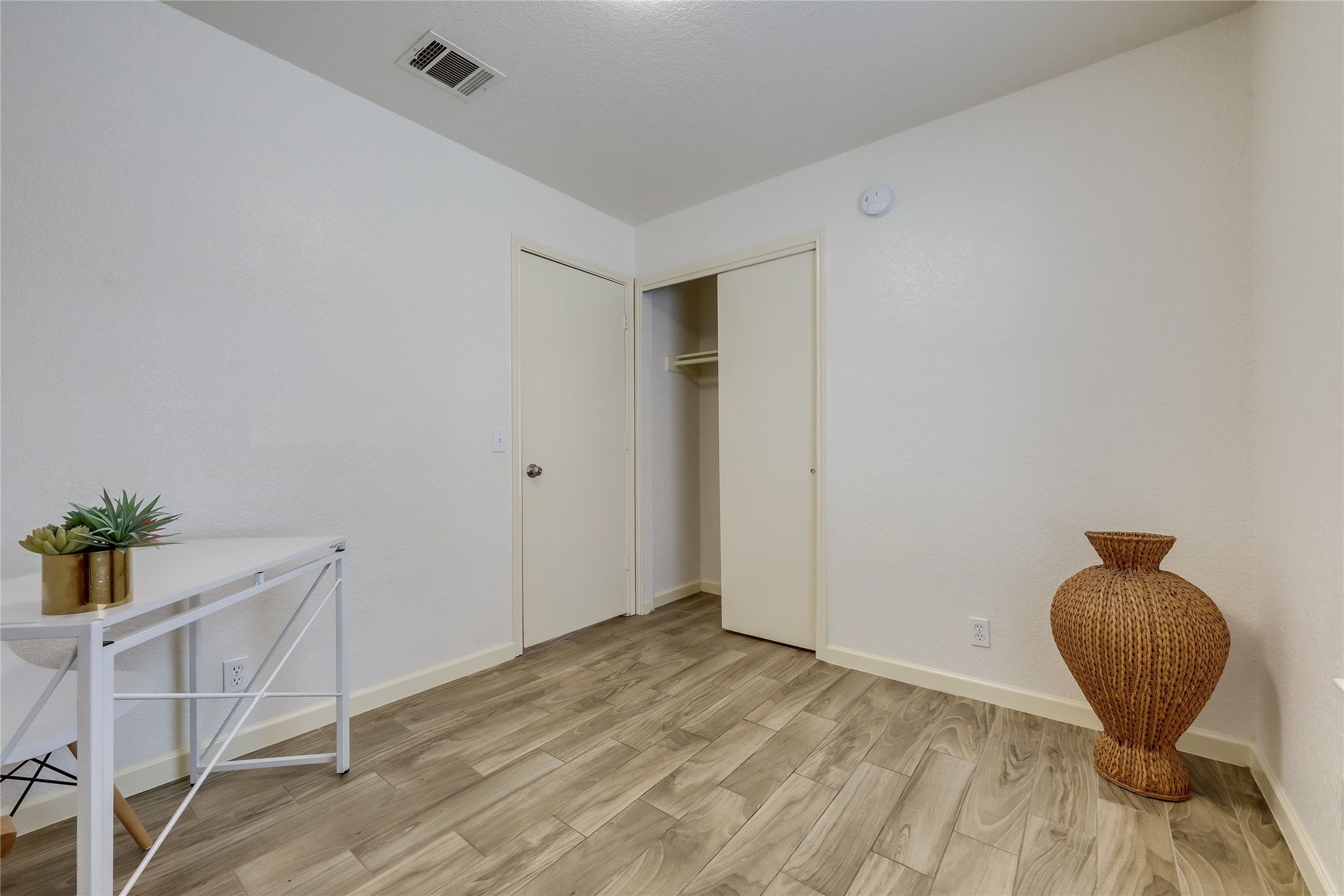 4510 Secure Lane Austin, TX 78725 - Photo 15 of 24 a view of a livingroom with wooden floor and chair