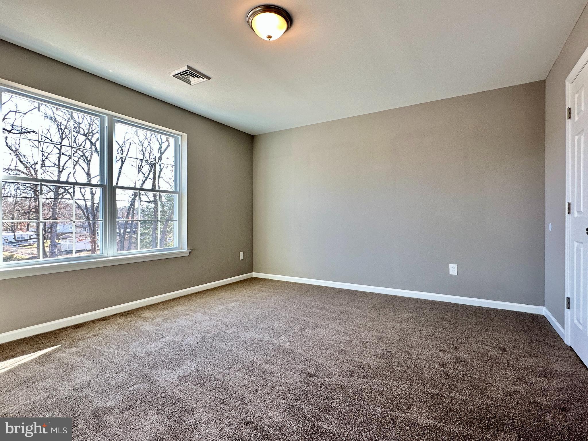 108 West Park Avenue Vineland, NJ 08360 - Photo 23 of 37 an empty room with a empty space and a window