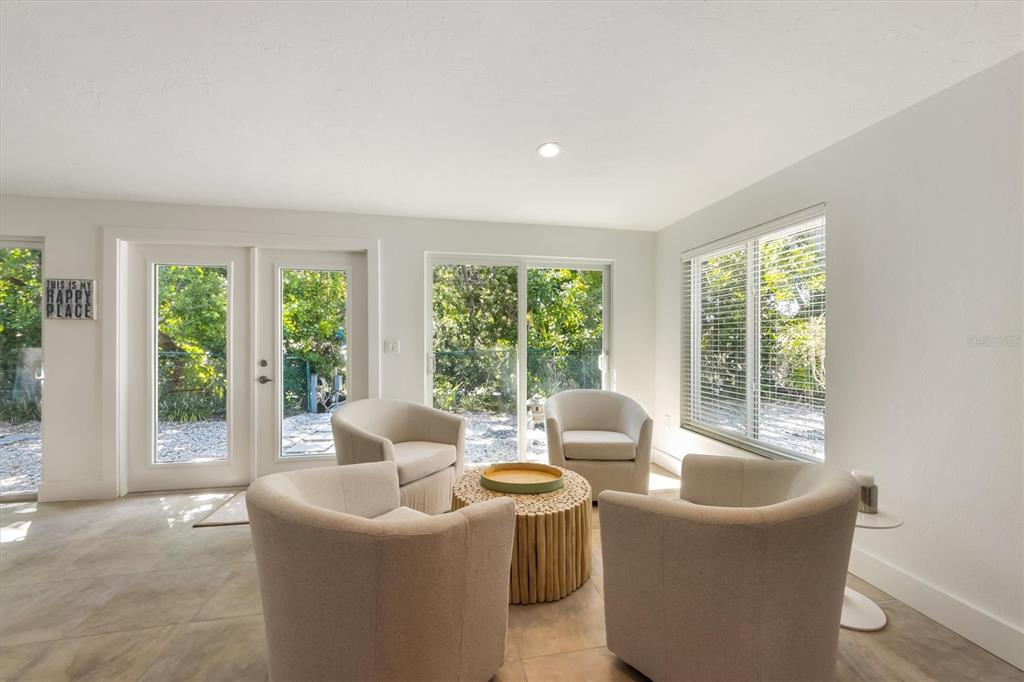 413 Poinsettia Road Anna Maria, FL 34216 - Photo 13 of 60 a living room with furniture and a large window