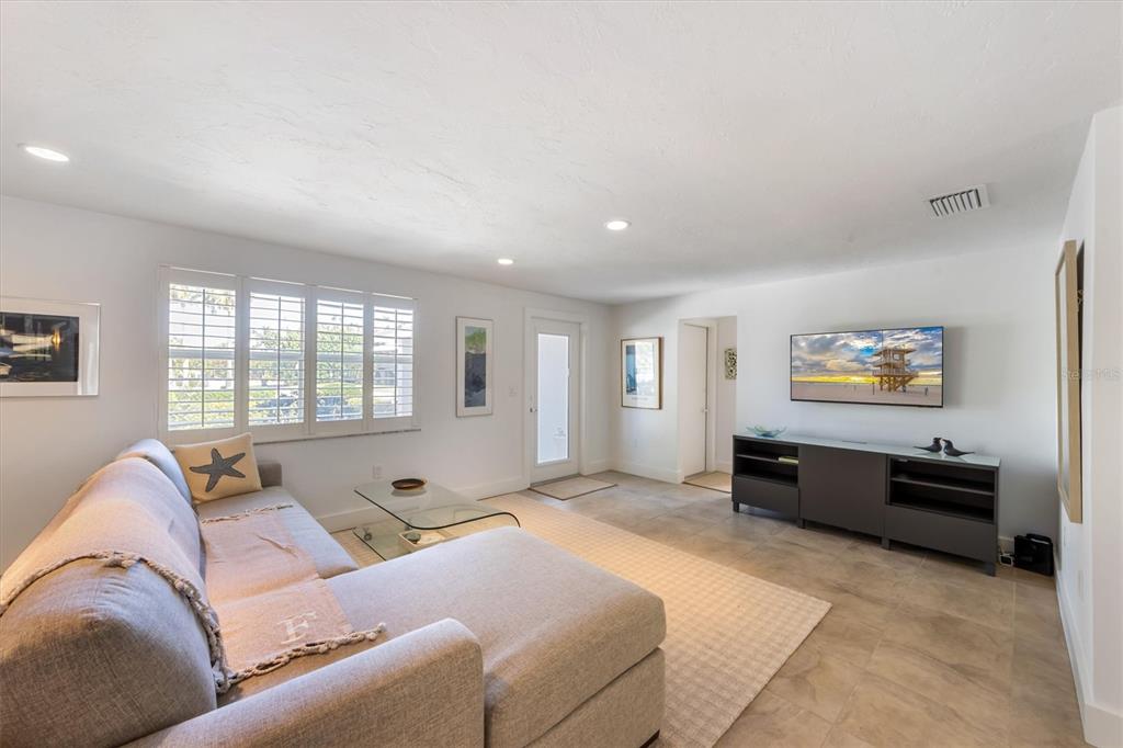 413 Poinsettia Road Anna Maria, FL 34216 - Photo 15 of 60 a living room with furniture and window