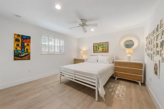 an aerial view of a house with a yard and lake view