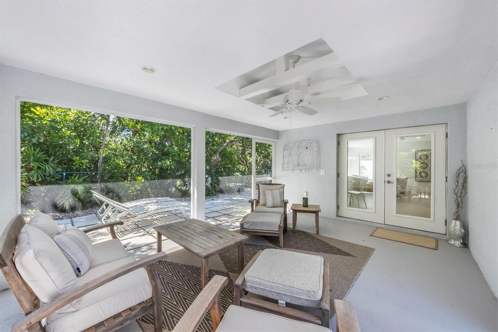 413 Poinsettia Road Anna Maria, FL 34216 - Photo 43 of 60 a living room with furniture and a large window