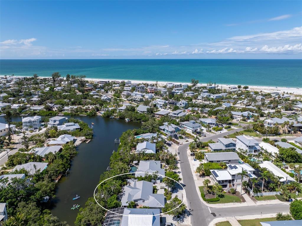 413 Poinsettia Road Anna Maria, FL 34216 - Photo 60 of 60 an aerial view of a city with lots of residential buildings and ocean in back