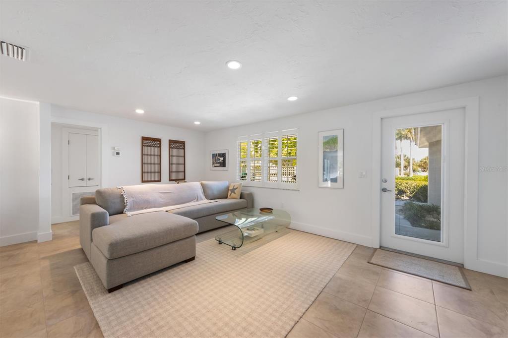 413 Poinsettia Road Anna Maria, FL 34216 - Photo 6 of 60 a living room with furniture and a window