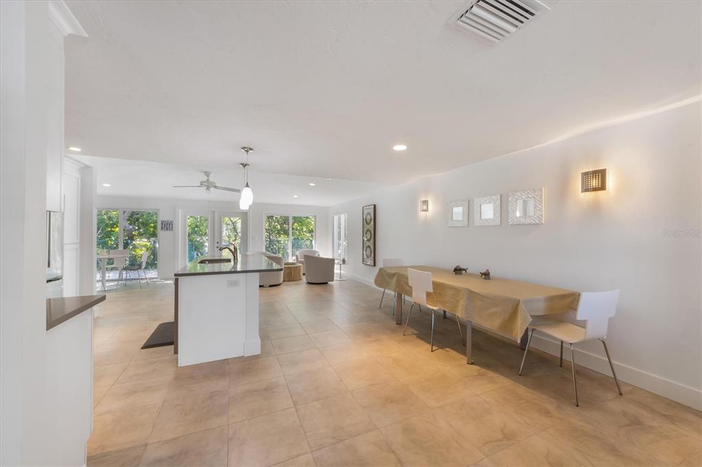 413 Poinsettia Road Anna Maria, FL 34216 - Photo 7 of 60 a large living room with furniture and a large window