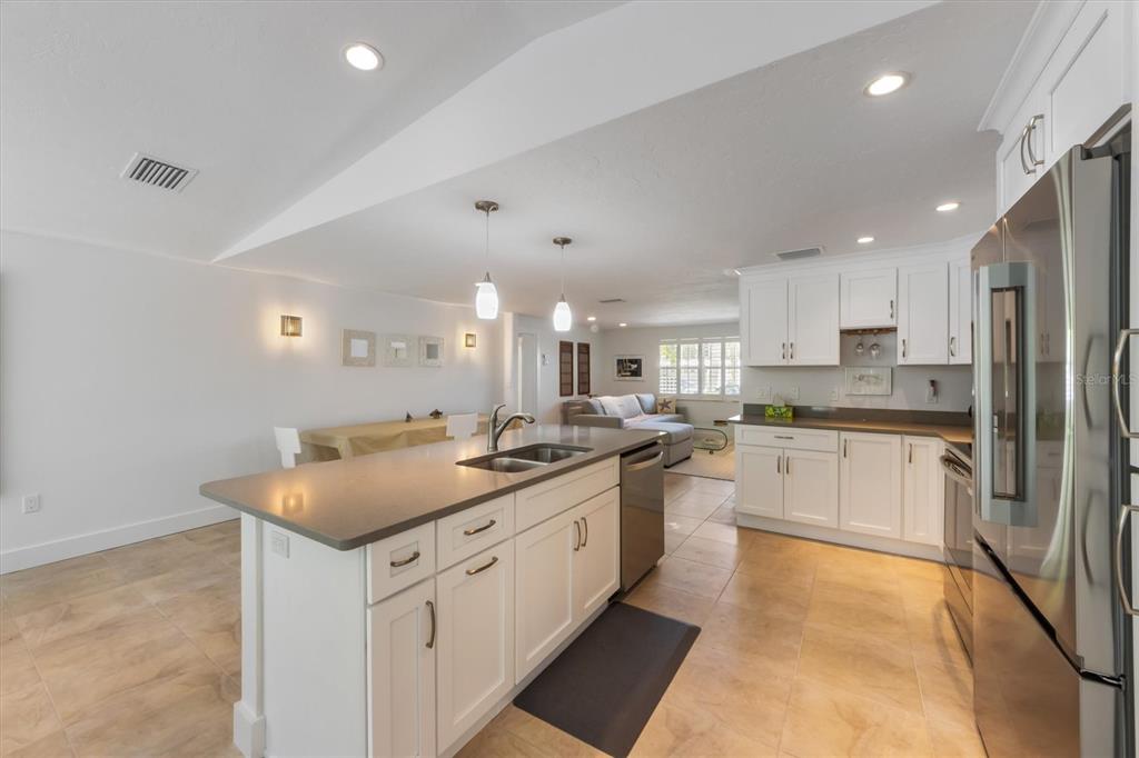 413 Poinsettia Road Anna Maria, FL 34216 - Photo 10 of 60 a kitchen with a sink stove and refrigerator