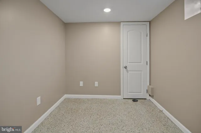 a bathroom with a granite countertop sink a toilet and a mirror