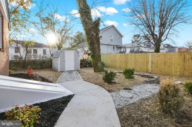 a view of a house with a yard covered in snow