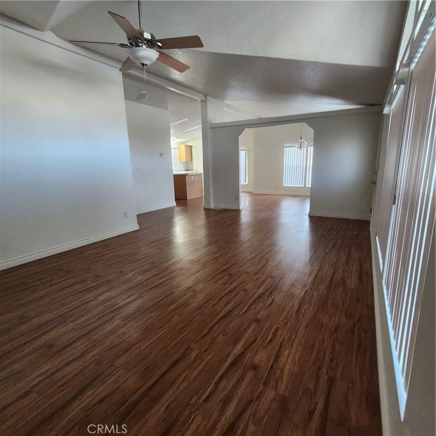 20843 Waalew Road, Unit C136 Apple Valley, CA 92307 - Photo 16 of 39 wooden floor in an empty room with a window