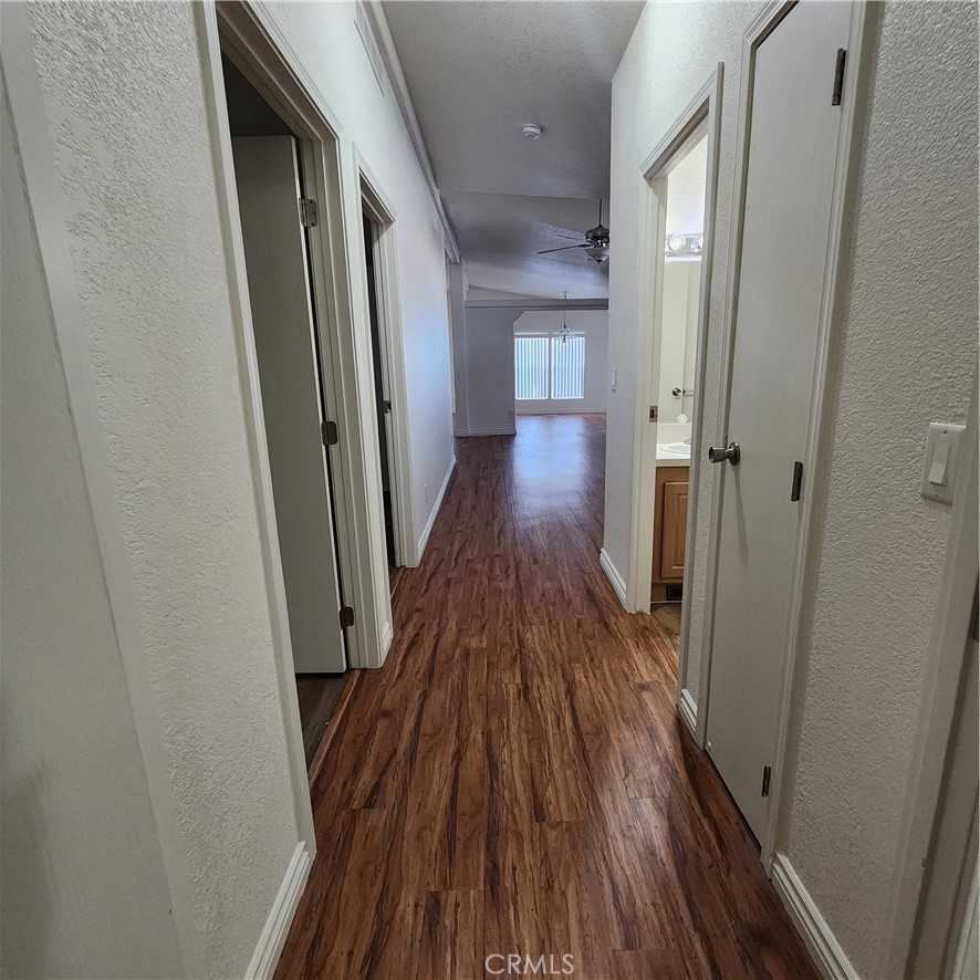 20843 Waalew Road, Unit C136 Apple Valley, CA 92307 - Photo 18 of 39 a view of a hallway with wooden floor and staircase