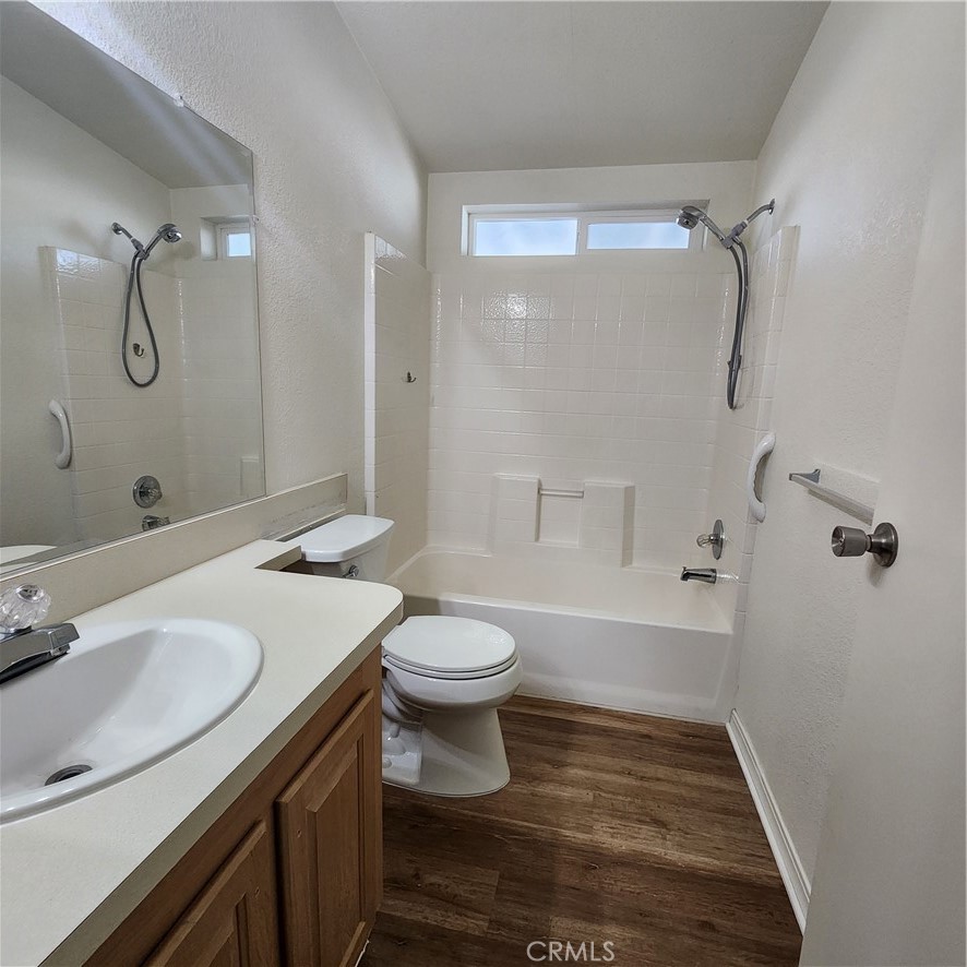 20843 Waalew Road, Unit C136 Apple Valley, CA 92307 - Photo 21 of 39 a bathroom with a sink a toilet and shower
