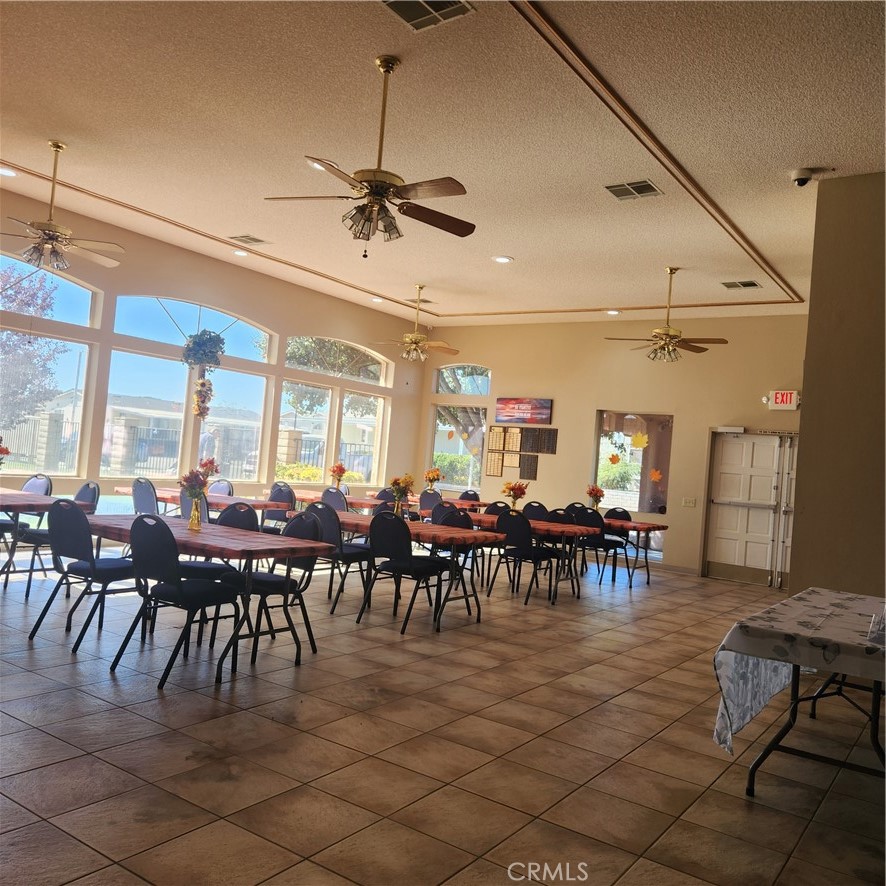 20843 Waalew Road, Unit C136 Apple Valley, CA 92307 - Photo 28 of 39 a view of a dining room with furniture window and outside view