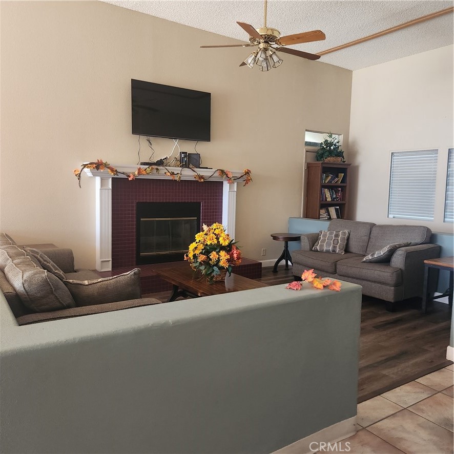 20843 Waalew Road, Unit C136 Apple Valley, CA 92307 - Photo 29 of 39 a living room with furniture and a flat screen tv