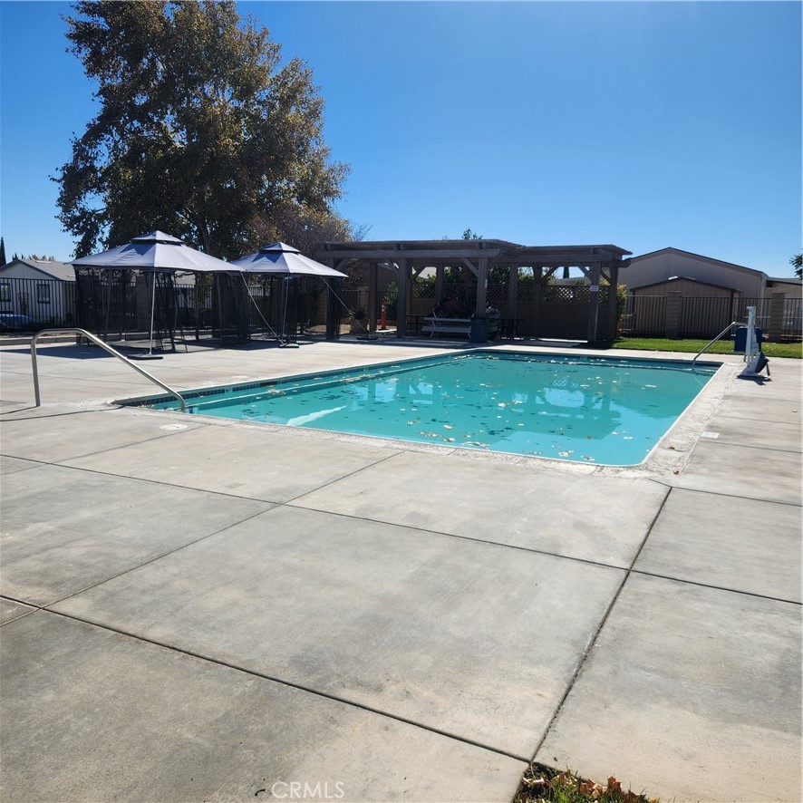 20843 Waalew Road, Unit C136 Apple Valley, CA 92307 - Photo 30 of 39 a front view of a house with a yard