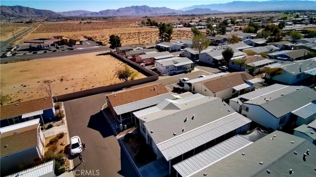 20843 Waalew Road, Unit C136 Apple Valley, CA 92307 - Photo 33 of 39 an aerial view of a house with a lake view