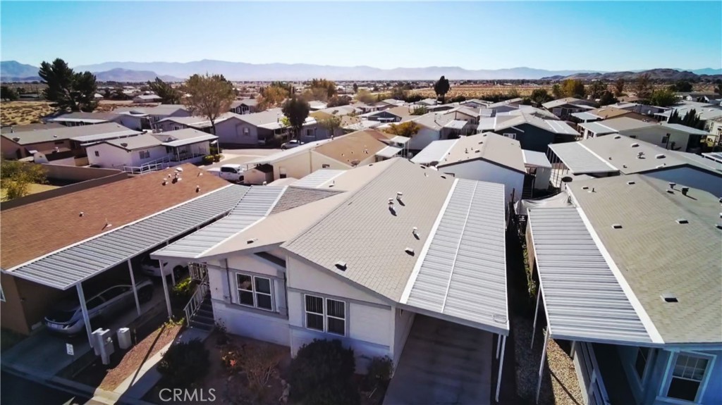 20843 Waalew Road, Unit C136 Apple Valley, CA 92307 - Photo 36 of 39 an aerial view of a house with parking space