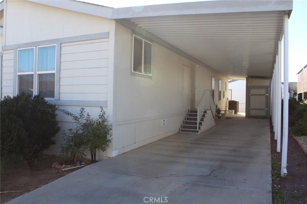 20843 Waalew Road, Unit C136 Apple Valley, CA 92307 - Photo 6 of 39 a view of a house with a garage