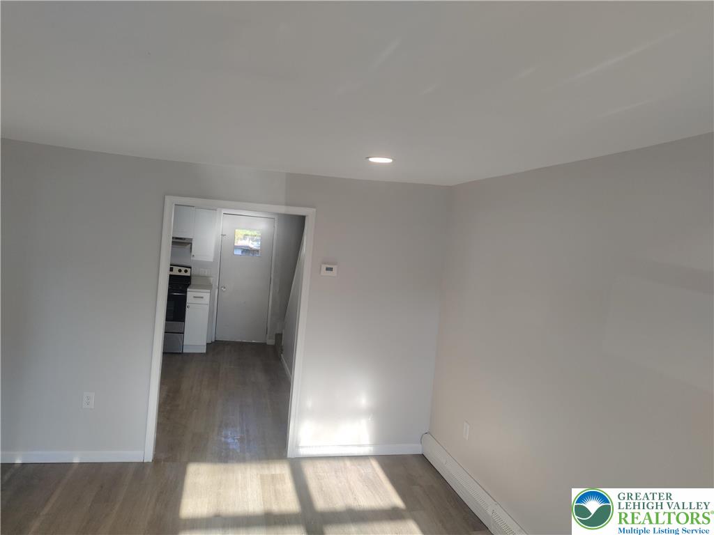 25 Franklin Street Weatherly, PA 18255 - Photo 14 of 40 a view of hallway with a large window and wooden floor