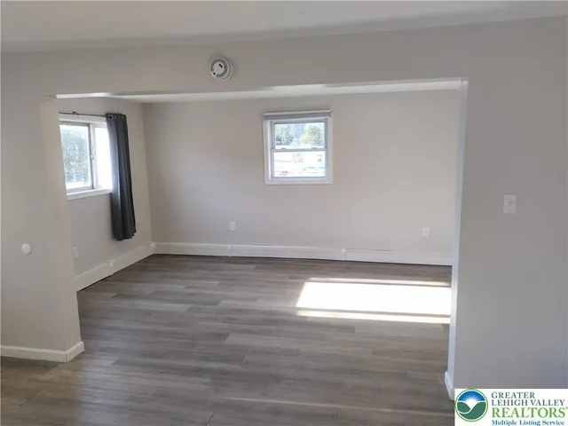 a view of an empty room and window