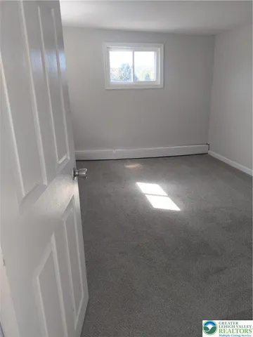 a view of an empty room and window