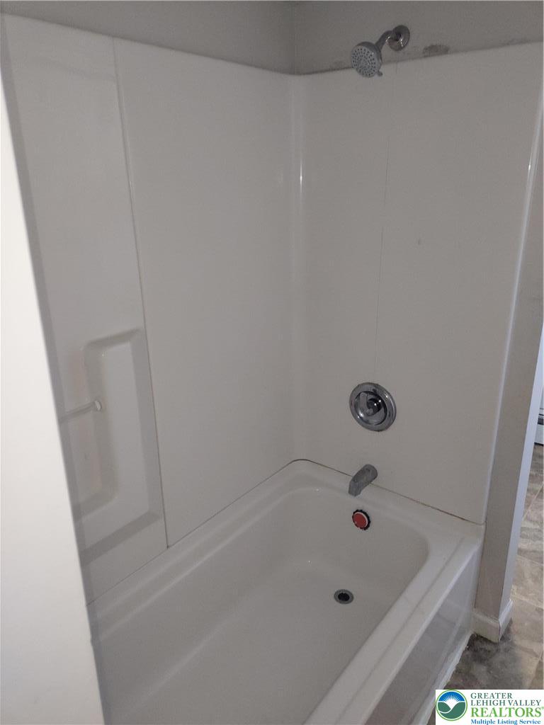 25 Franklin Street Weatherly, PA 18255 - Photo 35 of 40 a bathroom with a tub and a shower