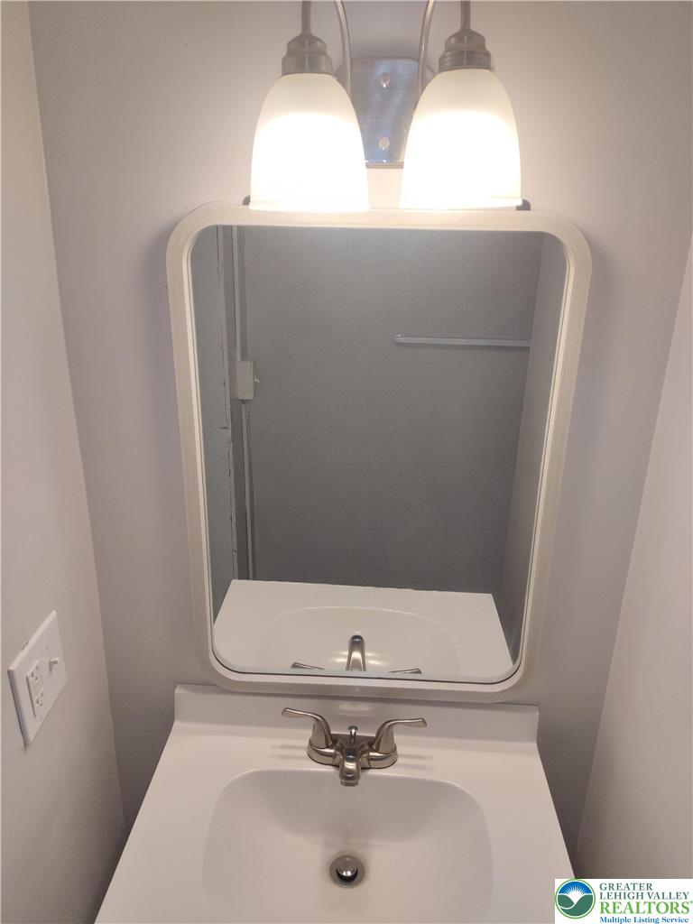 25 Franklin Street Weatherly, PA 18255 - Photo 37 of 40 a bathroom with a sink and mirror